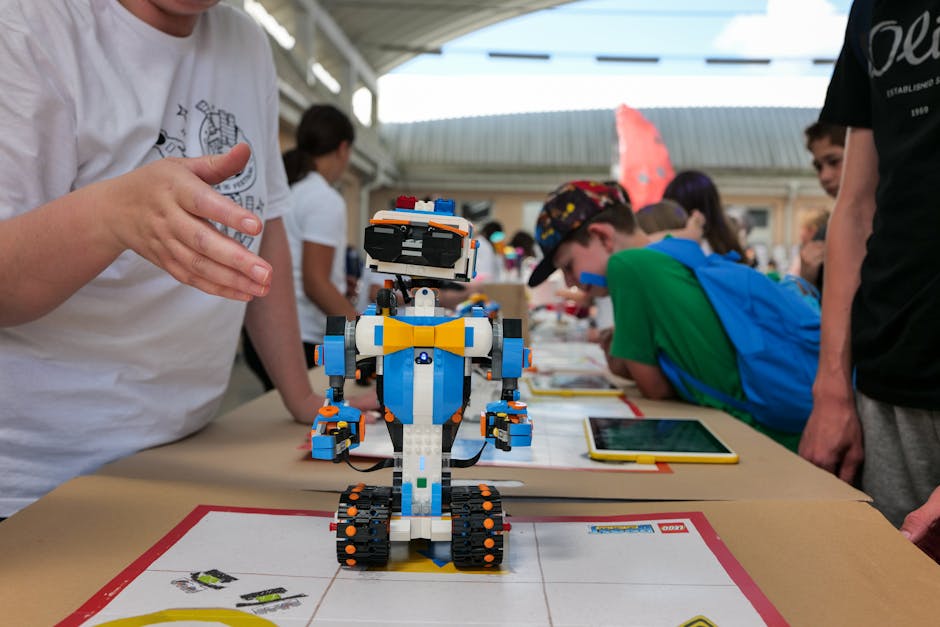 Children gathered around a robot they built, presenting their AI project at camp showcase